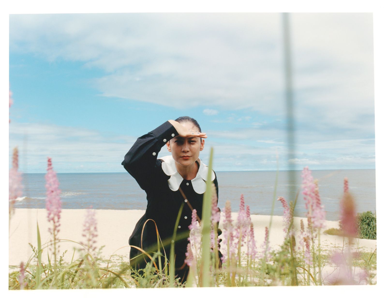 Image may contain Lee Boojin Blazer Clothing Coat Formal Wear Jacket Suit Face Head Person and Photography