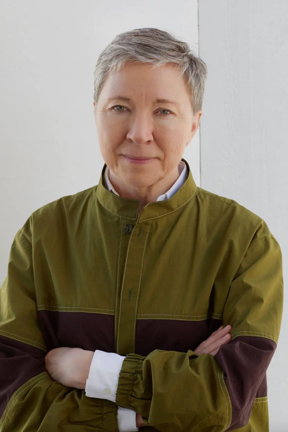 Image may contain Blonde Hair Person Clothing Coat and Head